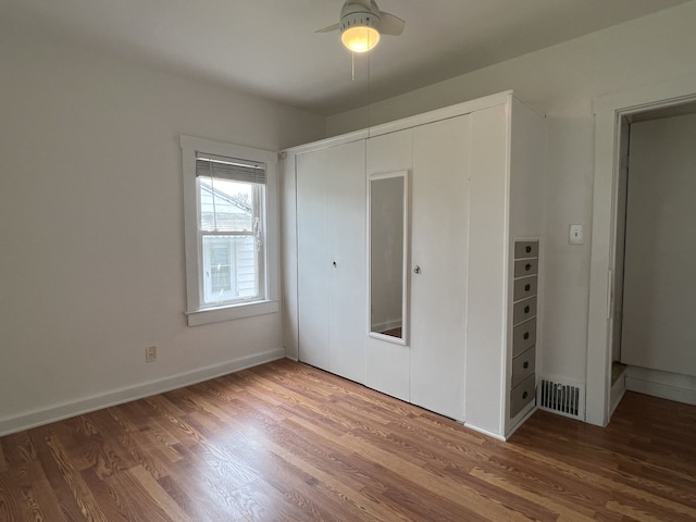 26741 Dartmouth St, Madison Heights, MI 48071 - unfurnished bedroom featuring wood finished floors, a closet, baseboards, and a ceiling fan