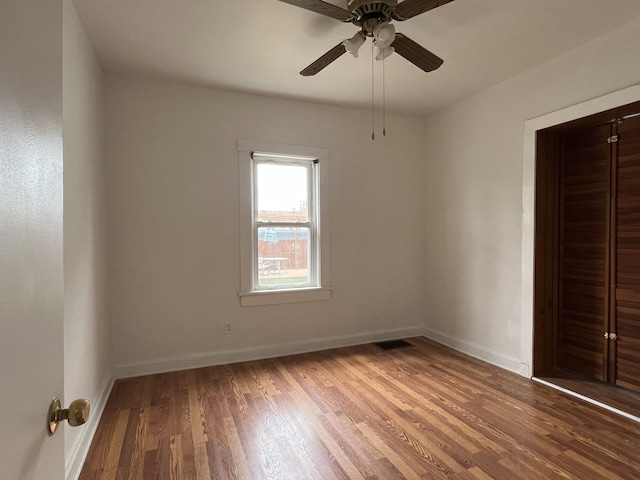 26741 Dartmouth St, Madison Heights, MI 48071 - unfurnished bedroom with wood finished floors, baseboards, and a ceiling fan
