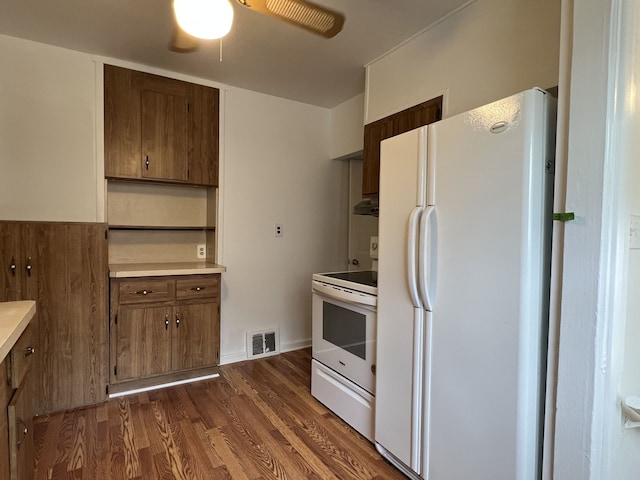 26741 Dartmouth St, Madison Heights, MI 48071 - kitchen featuring white appliances, a ceiling fan, dark wood-style floors, light countertops, and under cabinet range hood