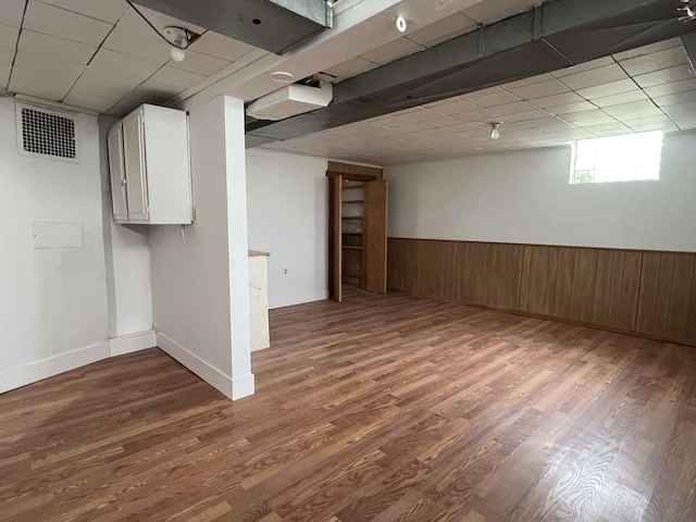 26741 Dartmouth St, Madison Heights, MI 48071 - below grade area featuring wood finished floors, wainscoting, wooden walls, and a drop ceiling