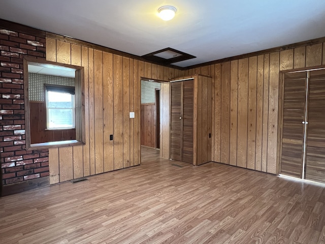 26741 Dartmouth St, Madison Heights, MI 48071 - unfurnished living room featuring wood finished floors and wooden walls