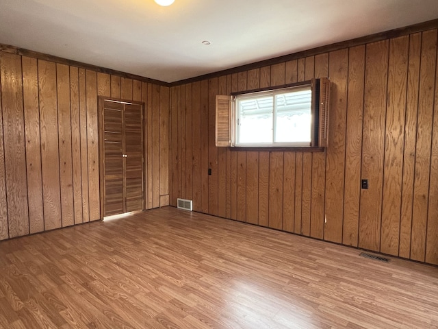 26741 Dartmouth St, Madison Heights, MI 48071 - unfurnished bedroom featuring wood finished floors and wooden walls