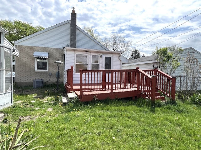 26741 Dartmouth St, Madison Heights, MI 48071 - back of property with a deck, brick siding, a chimney, a yard, and central AC unit