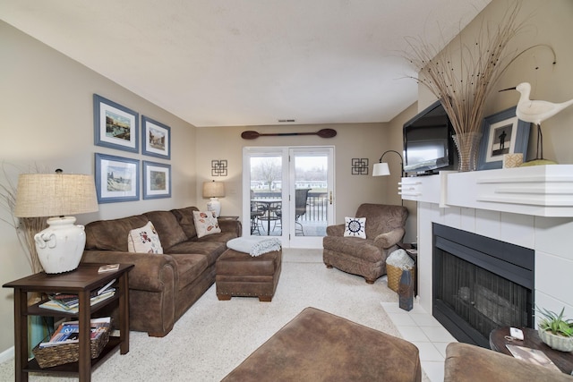 carpeted living area with a fireplace