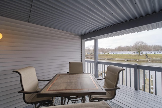 wooden deck featuring outdoor dining space