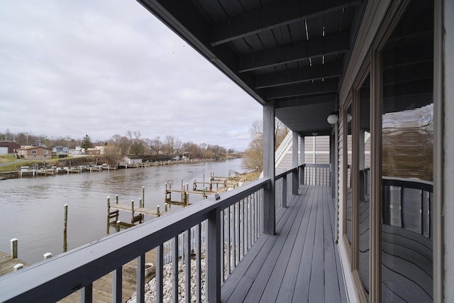 exterior space featuring a water view and a boat dock