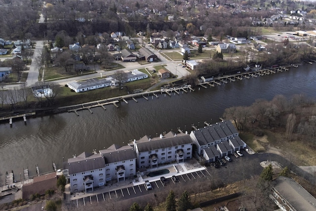 drone / aerial view with a water view and a residential view