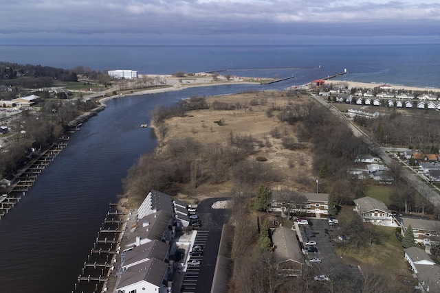 birds eye view of property featuring a water view