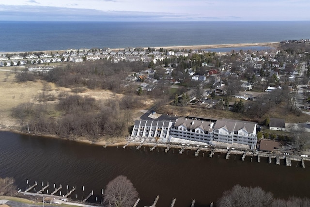 birds eye view of property featuring a water view and a residential view