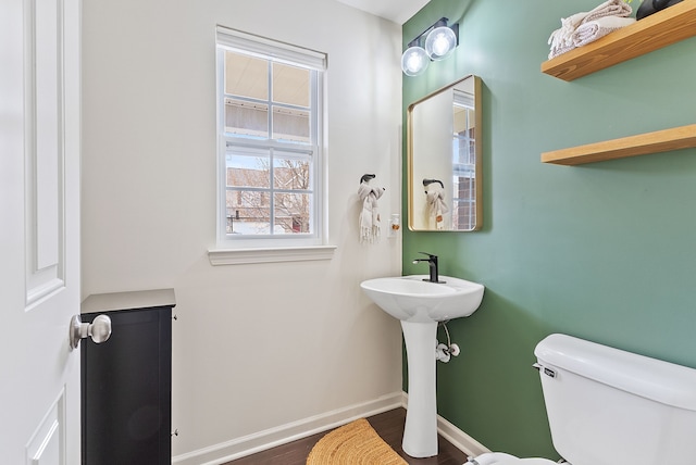 8079 Wildwood Ln, White Lake, MI 48386 - bathroom featuring toilet, baseboards, and wood finished floors