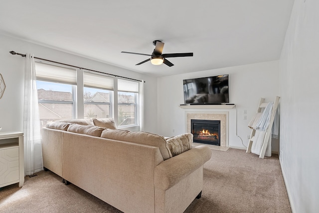 8079 Wildwood Ln, White Lake, MI 48386 - living area featuring a fireplace with flush hearth, ceiling fan, and light carpet