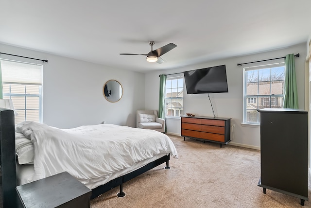 8079 Wildwood Ln, White Lake, MI 48386 - bedroom with light colored carpet, a ceiling fan, and baseboards
