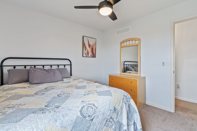 8079 Wildwood Ln, White Lake, MI 48386 - carpeted bedroom featuring baseboards and a ceiling fan