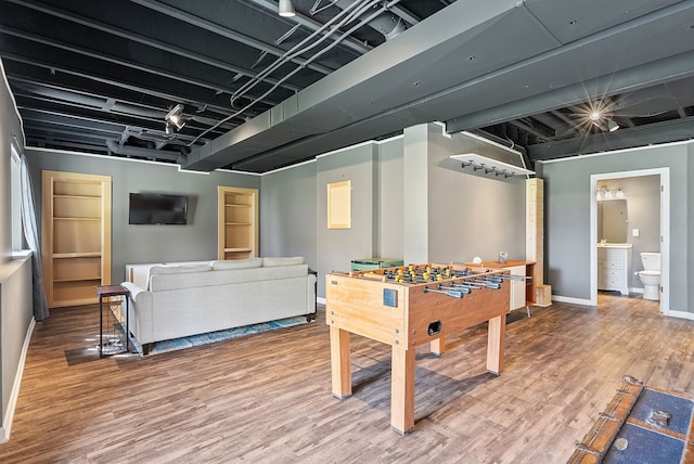 8079 Wildwood Ln, White Lake, MI 48386 - playroom featuring wood finished floors and baseboards