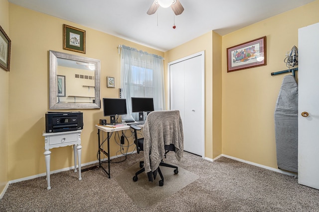 office featuring carpet flooring, baseboards, and a ceiling fan