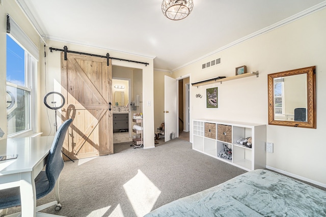 carpeted bedroom featuring a barn door, baseboards, crown molding, and visible vents
