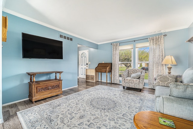 living room featuring baseboards, crown molding, wood finished floors, and visible vents