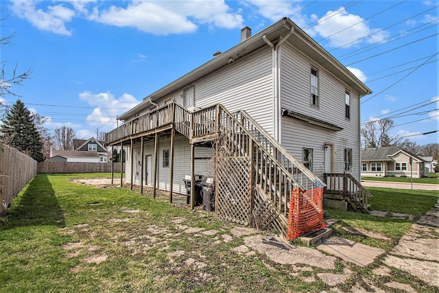 202 Poplar St, Three Oaks, MI 49128 - rear view of property with a wooden deck, a yard, a chimney, and fence
