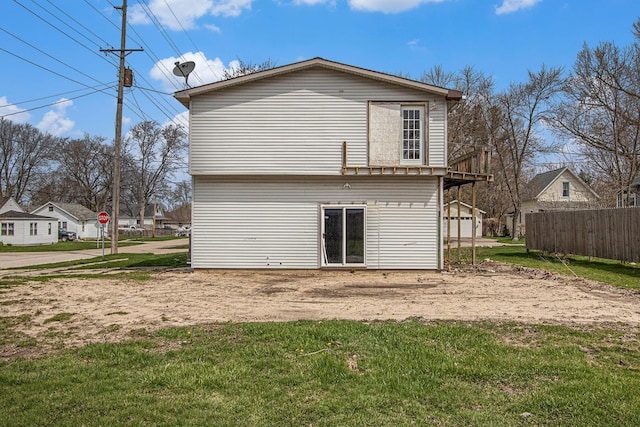 202 Poplar St, Three Oaks, MI 49128 - rear view of house with fence and a yard