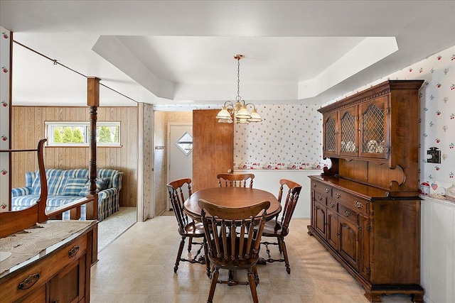 14953 Colpaert Dr, Warren, MI 48088 - dining room featuring light floors, a raised ceiling, a notable chandelier, and wallpapered walls