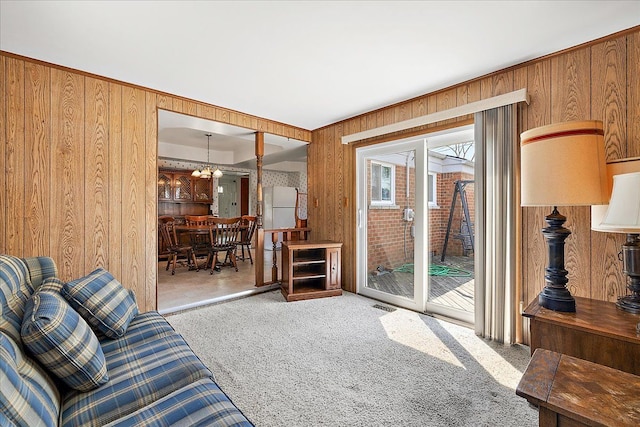14953 Colpaert Dr, Warren, MI 48088 - living room featuring visible vents, wood walls, and carpet
