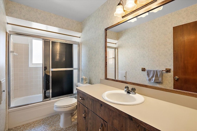 14953 Colpaert Dr, Warren, MI 48088 - full bathroom featuring vanity, bath / shower combo with glass door, and toilet