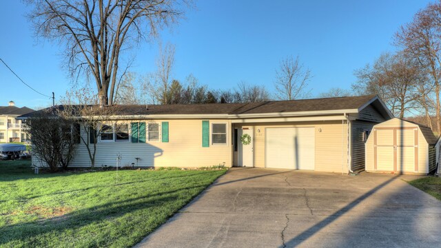 2103 Island Dr, Wayland, MI 49348 - single story home with a front yard, an outbuilding, a garage, a shed, and concrete driveway