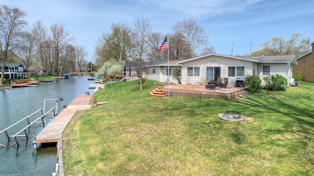 2103 Island Dr, Wayland, MI 49348 - exterior space with a water view, a dock, and a fire pit