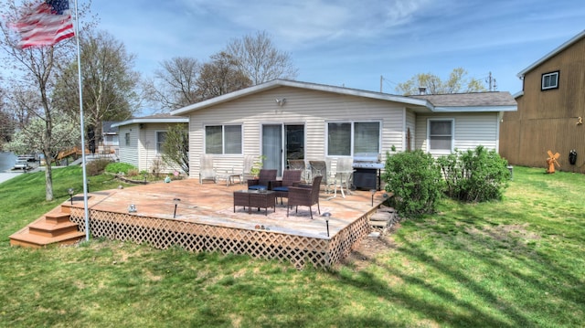 2103 Island Dr, Wayland, MI 49348 - rear view of property featuring a lawn and a wooden deck