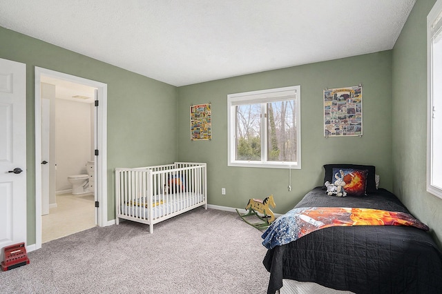 bedroom with carpet and baseboards