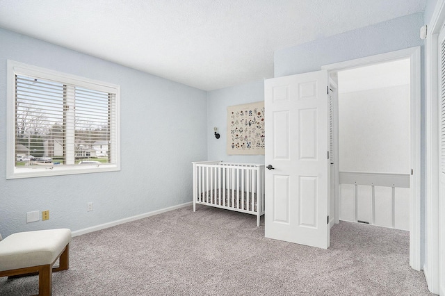 carpeted bedroom with baseboards