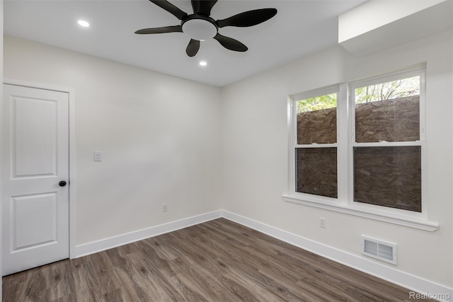 12061 Nashville St, Detroit, MI 48205 - empty room featuring dark wood-style flooring, baseboards, a ceiling fan, and recessed lighting
