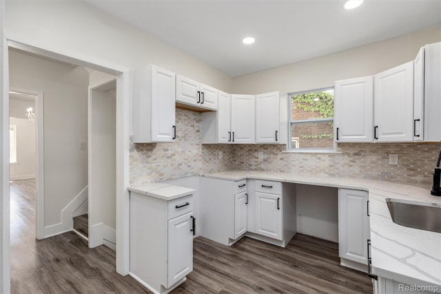12061 Nashville St, Detroit, MI 48205 - kitchen with dark wood-type flooring, white cabinetry, decorative backsplash, and recessed lighting
