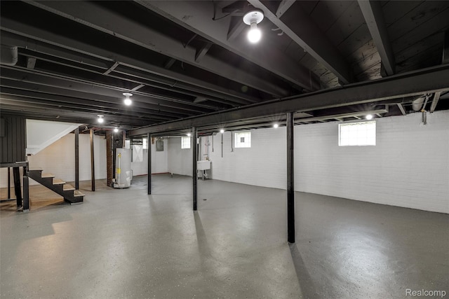 12061 Nashville St, Detroit, MI 48205 - basement featuring water heater, stairway, a sink, and brick wall