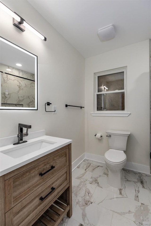 12061 Nashville St, Detroit, MI 48205 - bathroom featuring baseboards, vanity, toilet, and marble finish flooring