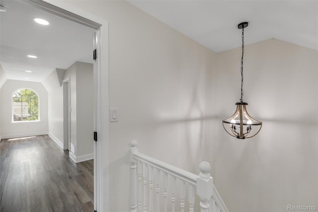 12061 Nashville St, Detroit, MI 48205 - corridor with lofted ceiling, an upstairs landing, dark wood-type flooring, baseboards, and a chandelier