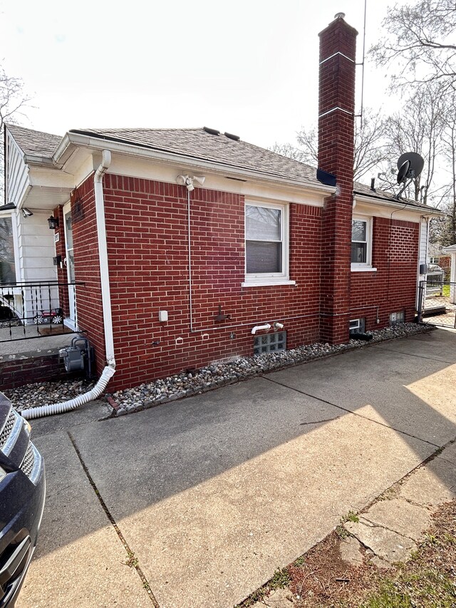 13973 Brady, Redford, MI 48239 - view of property exterior featuring brick siding, a chimney, and a shingled roof