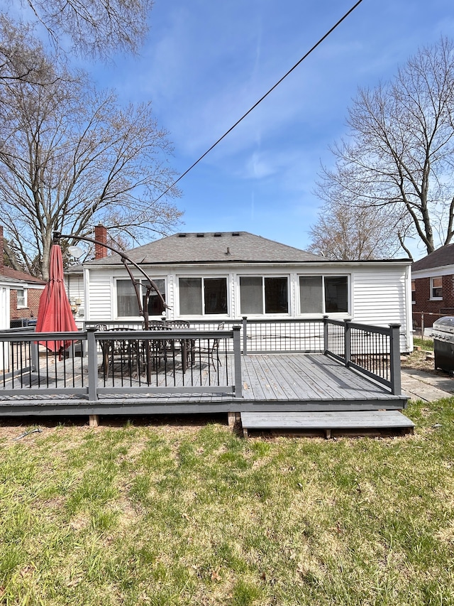 13973 Brady, Redford, MI 48239 - rear view of property with a lawn and a wooden deck