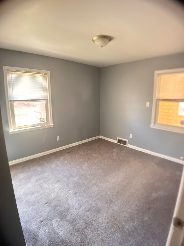 13973 Brady, Redford, MI 48239 - spare room featuring dark carpet and baseboards