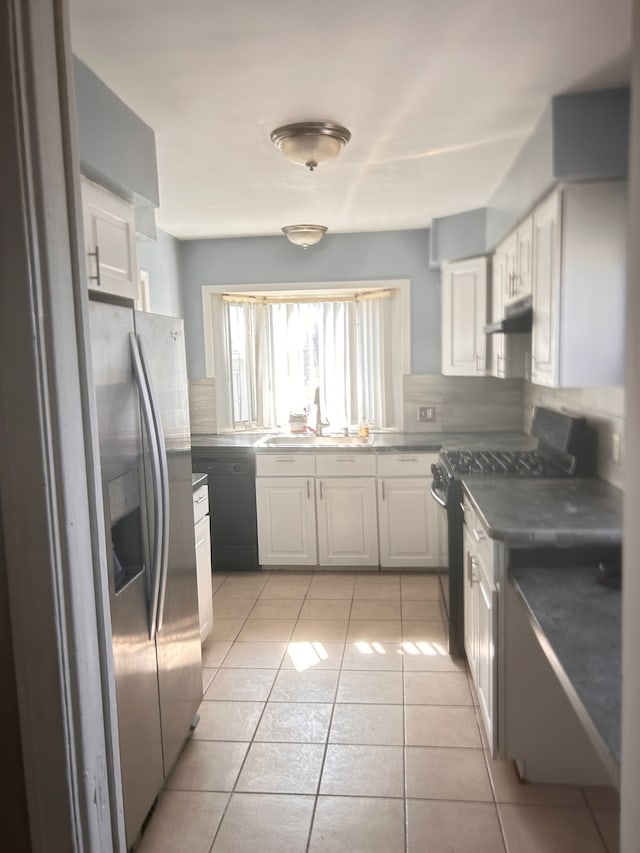 13973 Brady, Redford, MI 48239 - kitchen with black appliances, a sink, under cabinet range hood, backsplash, and light tile patterned flooring