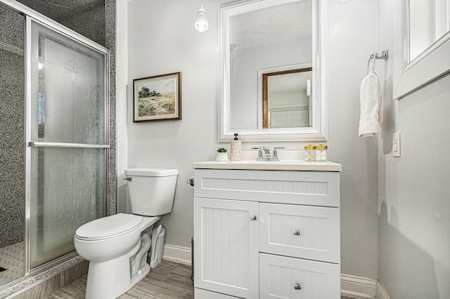 2569 Ridgewood Trl, Berrien Springs, MI 49103 - bathroom with a shower stall, vanity, toilet, and baseboards