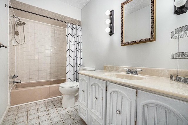 2569 Ridgewood Trl, Berrien Springs, MI 49103 - bathroom with tile patterned floors, toilet, vanity, shower / tub combo, and a textured ceiling
