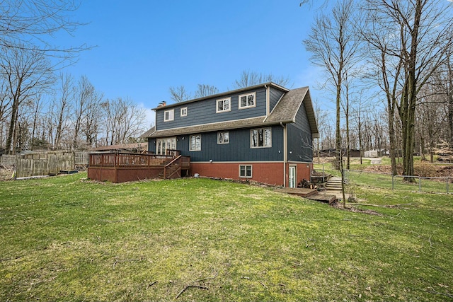 2569 Ridgewood Trl, Berrien Springs, MI 49103 - back of house featuring a lawn, fence, stairway, and a deck