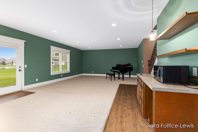 6501 Andres Xing Unit 14, Grandville, MI 49418 - living room featuring baseboards, recessed lighting, and light colored carpet