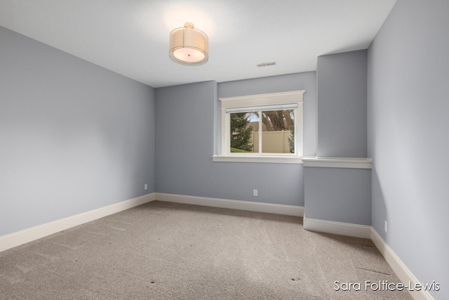 6501 Andres Xing Unit 14, Grandville, MI 49418 - spare room with carpet floors, visible vents, and baseboards