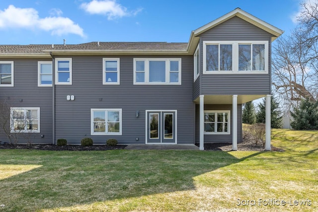 6501 Andres Xing Unit 14, Grandville, MI 49418 - rear view of property with a yard