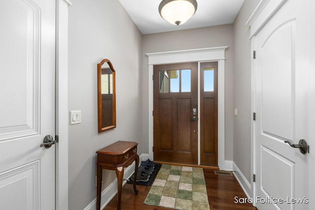 6501 Andres Xing Unit 14, Grandville, MI 49418 - entrance foyer featuring baseboards and dark wood-style floors