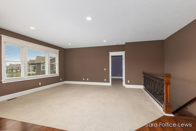 6501 Andres Xing Unit 14, Grandville, MI 49418 - empty room featuring baseboards, wood finished floors, visible vents, and recessed lighting