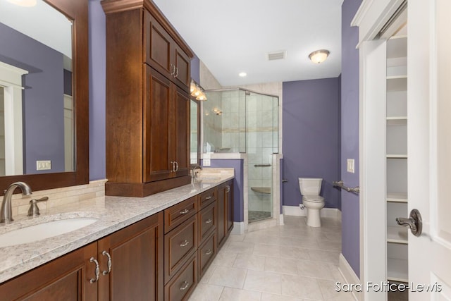 6501 Andres Xing Unit 14, Grandville, MI 49418 - full bathroom with a sink, toilet, baseboards, tile patterned flooring, and a shower stall