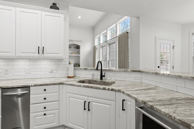 2693 Sanctuary Dr, Stevensville, MI 49127 - kitchen featuring a sink, backsplash, white cabinetry, light stone counters, and beverage cooler